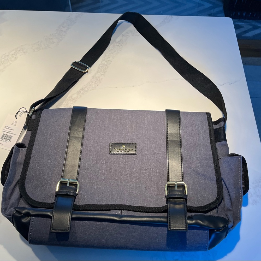 NWT London fog denim canvas messenger bag.   Lots of pockets! Adjustable strap.